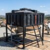Loft tank mounted on a rooftop stand at a home in Kenya