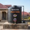 3000 litre Poa cylindrical water tank installed outside a Kenyan home