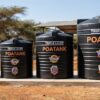 Range of different sized Poa water tanks displayed side by side in Kenya